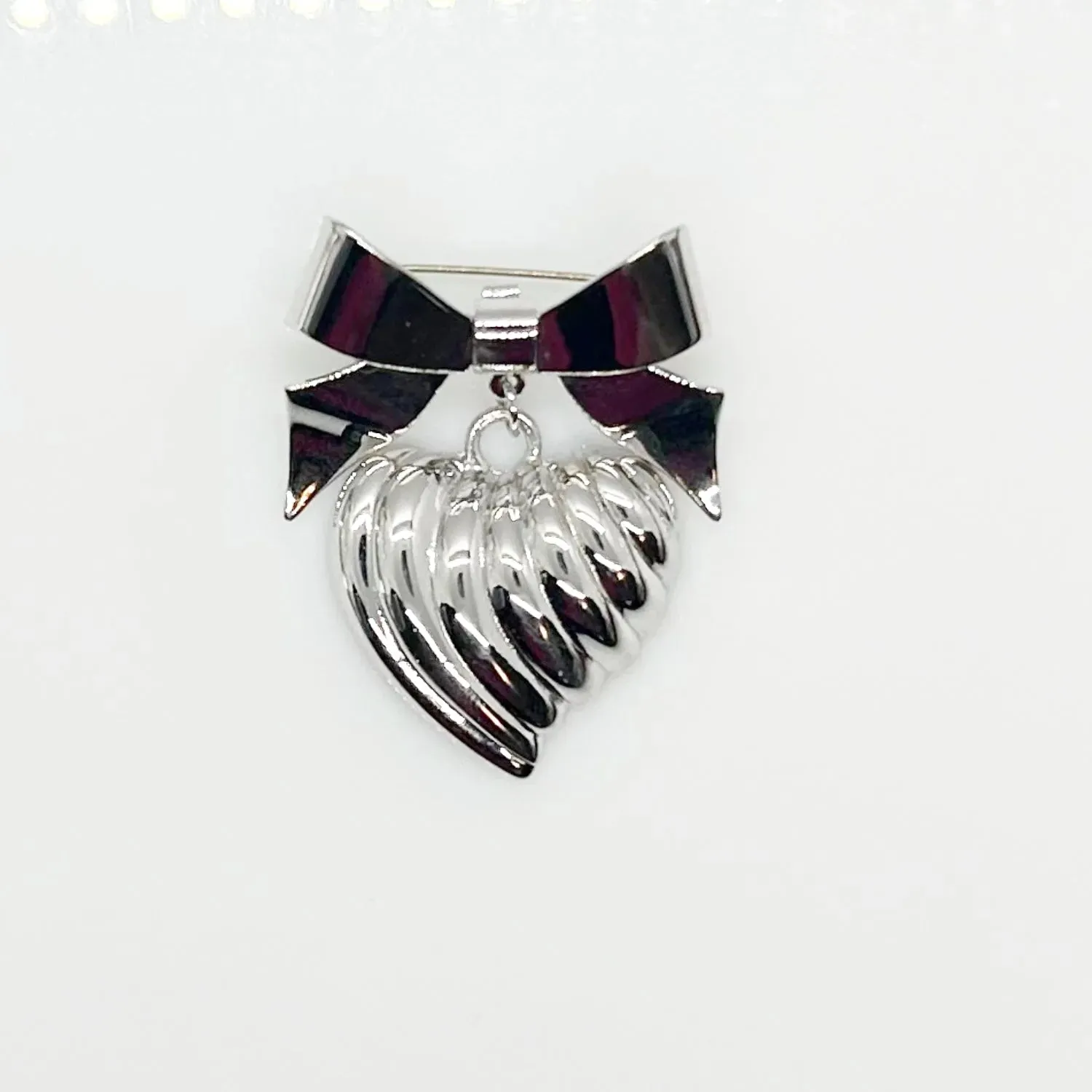 KJL Silver Tone Puffed Heart and Bow Brooch